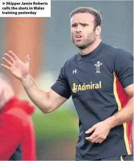  ??  ?? > Skipper Jamie Roberts calls the shots in Wales training yesterday