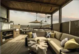  ?? PHOTOS COURTESY OF CHICAGO ROOF DECK AND GARDEN VIA AP ?? A large rooftop lounging space.