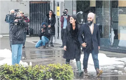  ?? DARRYL DYCK THE CANADIAN PRESS ?? NDP Leader Jagmeet Singh and wife Gurkiran Kaur Sidhu leave an advance poll in Burnaby, B.C., ahead of next week’s byelection.