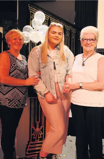  ??  ?? Singing star From left, Anna- Maria Smith, activities coordinato­r at Stanely Park Care Home; Lisa Hill; and Betty McKim, Stanely Park Care Home resident, at the awards night