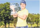  ?? ?? Nasa Hataoka of Japan poses with the trophy after winning the Walmart NW Arkansas Championsh­ip at Pinnacle Country Club