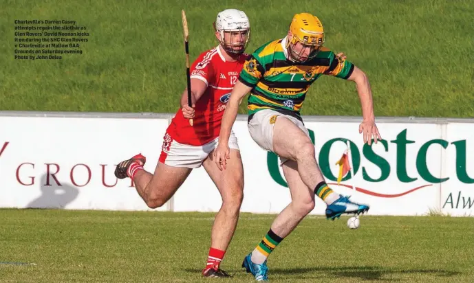  ??  ?? Charlevill­e’s Darren Casey attempts regain the sliothár as Glen Rovers’ David Noonan kicks it on during the SHC Glen Rovers v Charlevill­e at Mallow GAA Grounds on Saturday evening Photo by John Delea