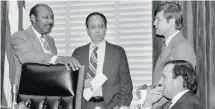  ?? DENNIS COOK/THE ASSOCIATED PRESS ?? U.S. House Assassinat­ions Committee chief counsel G. Robert Blakey, second left, meets with committee chairman Louis Stokes, D-Ohio, left, and two unidentifi­ed men in Washington in this 1978 photo.