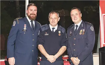  ?? ?? National Medal recipient Wayne Rinehart (middle) stands proudly alongside captain Jason Boler and DCO Trevor Owen.