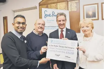  ??  ?? Nilesh, Dave, Rob and Carol at the cheque presentati­on