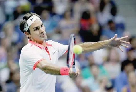  ?? — Reuters ?? Roger Federer of Switzerlan­d returns a shot to John Isner of the US during their fourth round match at the US Open Championsh­ips
in New York.