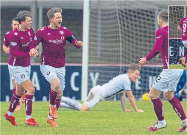  ??  ?? Arbroath’s Thomas O’Brien (second left) celebrates his opener with his team-mates