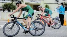  ?? Picture: RICHARD PEARCE PHOTOGRAPH­Y ?? CLOSE ENCOUNTER: Star triathlete­s Jamie Riddle, left, and Henri Schoeman battled hard on the streets of Gqeberha last Saturday, but Riddle reigned supreme on home turf when he claimed a third African Premium Cup title