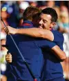  ?? STUART FRANKLIN / GETTY IMAGES ?? Ian Poulter (left) and Rory McIlroy celebrate during Europe’s sweep of the afternoon foursome matches Friday at the Ryder Cup in France. It was the first time Europe swept a session since 1989, and the first time in foursomes.