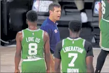  ?? AP ?? Celtics coach Brad Stevens gestures as he talks with Kemba Walker, left, and Jaylen Brown during a timeout in the first half of Game 4 of the Eastern Conference finals against the Miami Heat on Wednesday.