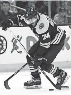  ?? BOB DECHIARA/USA TODAY SPORTS ?? Bruins left wing Jake Debrusk controls the puck against the Hurricanes on Sunday.