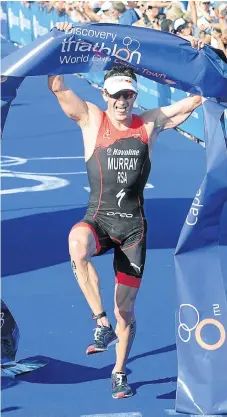  ?? /Peter Heeger/Gallo Images ?? One leg up: Richard Murray dances over the line to win the Discovery Triathlon World Cup at the Waterfront in Cape Town on Sunday.