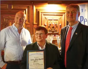  ??  ?? Ailish Whelan accepted a certificat­e of excellence on behalf of the Wicklow Parish Hospitalit­y Group at last year’s Nell Healy Parish Awards with Joe Healy (left) and Tom Mulvihill, past president, Rotary Club of Wicklow.