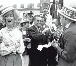  ?? ABOVE BY AP; RIGHT, MONTGOMERY ADVERTISER ?? Above, on June 28, 1968, presidenti­al candidate and former Alabama Gov. George Wallace arrives in Boston. At right, a rally in September at Garrett Coliseum in Montgomery, Ala.