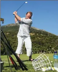  ??  ?? Leisure time: Teeing off on the driving range