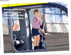  ??  ?? George is overcome with delight in a helicopter just like Dad’s, in Hamburg.