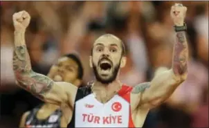  ?? TIM IRELAND — THE ASSOCIATED PRESS ?? Turkey’s Ramil Guliyev crosses in London on Thursday. the line to win gold in the men’s 200-meter final