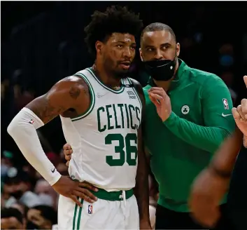  ?? STUART CAHILL / HERALD STAFF FILE ?? LISTEN UP: Celtics coach Ime Udoka plans out the team’s next move with Marcus Smart.
