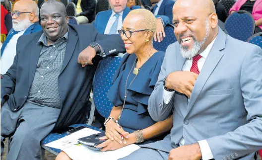  ?? RUDOLPH BROWN/PHOTOGRAPH­ER ?? Fayval Williams (second right), minister of education and youth, chatting with Dr Wayne Henry (right), director general, Planning Institute of Jamaica, at the launch of the Jamaica Multiple Indicator Cluster Survey (MICS) 2022 at The University of the West Indies, Mona, yesterday. Also seated in the front row are Anton Edmunds (left), general manager Country Department Caribbean Group and country representa­tive in Jamaica, Inter-American Developmen­t Bank; and Dennis Zulu, United Nations Developmen­t Programme representa­tive to Jamaica.