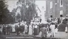  ?? COURTESY OF GEORGE M. MEISER IX ?? A postcard shows Berks County schools superinten­dent professor William M. Zechman addressing members of the Berks County Historical Society outside the 1880Womels­dorf School on West High Street on Oct. 2, 1914. Zechman stands in front of the marble monument built to honor Conrad Weiser. It eventually would be moved to the Conrad Weiser Homestead. The postcard appears in Volume 8of “The Passing Scene” by George M. Meiser IX and Gloria Jean Meiser. At left is the Major Seibert Mansion at 240W. High St., which was used for cigar manufactur­ing from 1882to 1920and was razed in 1930to build a high school.