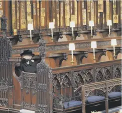  ?? ?? Above: The Queen sits alone at Prince Philip’s funeral last year when Covid restrictio­ns meant only 30 people could attend the service. Left: The Queen and Philip in 2017. Below: Philip’s coffin, in an adapted Land Rover hearse, arrives ahead of the funeral