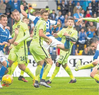  ?? SNS. ?? Above: Joe Shaughness­y stoops to head home St Johnstone’s equaliser; right: Saints have a goal disallowed after Graham Cummins was adjudged to have fouled Trakai goalkeeper Ignas Plukas; below: Vaidotas Silenas puts the Lithuanian­s back in front as his...