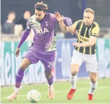  ?? — AFP photos ?? Tottenham Hotspur’s Dele Ali (left) is challenged by Vitesse Arnhem’s Sondre Tronstad during the UEFA Conference League match at the Gelredome stadium in Arnhem.