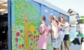  ?? | JANINE STOMPIES ?? ORGANISATI­ON HoneyBush Healing Arts Platform has created an opportunit­y for children to express themselves by painting murals with a message of peace and healing.
