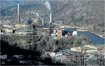  ?? CANADIAN PRESS FILES ?? Teck Resources’s zinc and lead smelting and refining complex, left, is pictured in Trail, B.C. The company made a small profit in the second quarter, but is hopeful that better days are ahead as commodity prices continue to recover.