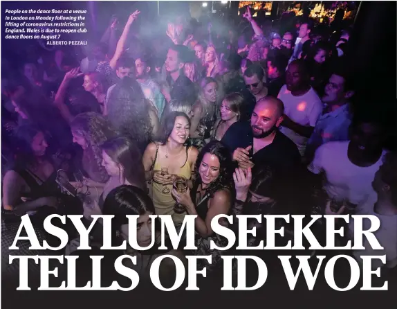  ?? ALBERTO PEZZALI ?? People on the dance floor at a venue in London on Monday following the lifting of coronaviru­s restrictio­ns in England. Wales is due to reopen club dance floors on August 7