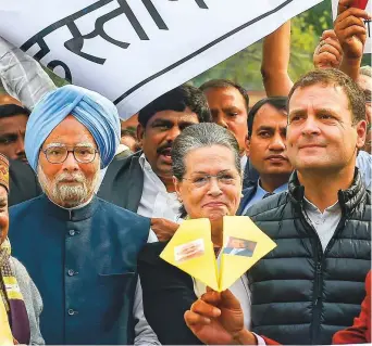  ?? PTI ?? Congress president Rahul Gandhi, senior party leaders Sonia Gandhi, Manmohan Singh and others during a protest over the Rafale deal in front of Mahatma Gandhi’s statue outside Parliament in New Delhi yesterday.