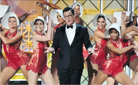  ?? FREDERIC J. BROWN/GETTY IMAGES ?? 2017 Emmy host Stephen Colbert dances onstage during the 69th edition of the awards last September.