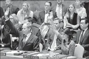  ?? AP/MARK LENNIHAN ?? Matthew Rycroft, Britain’s U.N. ambassador, and U.S. Ambassador Nikki Haley vote in favor of new North Korea sanctions on Friday at United Nations headquarte­rs.