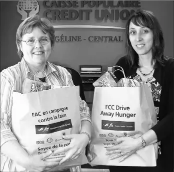  ?? SUBMITTED PHOTO ?? Angèle Arsenault, left, president of the Conseil de développem­ent coopératif de l’Î.- P.- É., and Diane McInnis, marketing officer with Evangeline- Central Credit Union, encourage everyone from the Evangeline area to participat­e in Co- op Week...