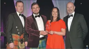  ??  ?? Graham Nicolson, group buying director at Aldi, sponsor of the Artisan Food category, with Harry and Ava Maitland of The Wee Isle Dairy, and Fred MacAulay.