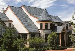  ?? Photo courtesy of Ecostar ?? Attractive recycled plastic roofing materials can be made into many styles. Notice the roof ridge vent for efficiency.