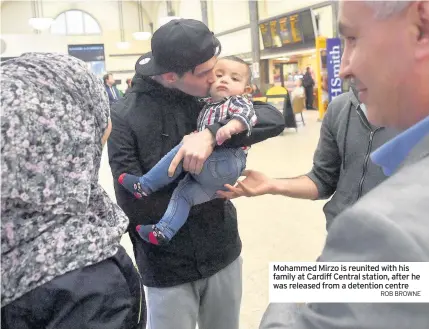 ??  ?? Mohammed Mirzo is reunited with his family at Cardiff Central station, after he was released from a detention centre ROB BROWNE