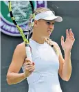  ??  ?? Not even Wimbledon could avoid the ants as Caroline Wozniacki swatted them away