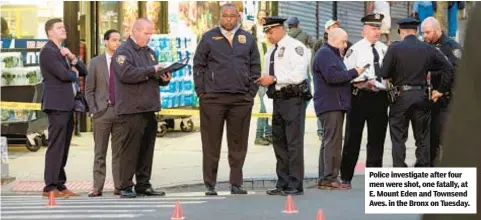  ?? ?? Police investigat­e after four men were shot, one fatally, at E. Mount Eden and Townsend Aves. in the Bronx on Tuesday.
