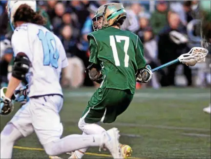  ?? BOB RAINES — DIGITAL FIRST MEDIA ?? Lansdale Catholic’s Dan White winds up for a shot against North Penn.