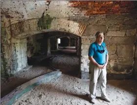  ??  ?? Glenn Oder, executive director of Fort Monroe Authority, is shown Aug. 11 at the old officers’ club underneath flagstaff bastion of Fort Monroe.