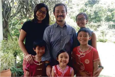  ??  ?? Chan and her family who inspired her debut memoir ‘Joy Amidst Diapers’.