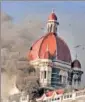  ?? HT FILE ?? Smoke comes out from the main Dom of Taj Hotel that was a target of LET terrorists on 26/11.