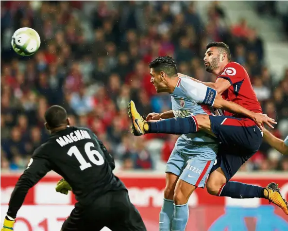  ??  ?? Monaco’s Radamel Falcao (centre) scoring the first of his two goals against Lille on Friday. — Reuters High achiever: