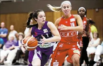  ??  ?? Shaler grad Val McQuade, right, has battled back from a torn ACL to play profession­al basketball in Germany.