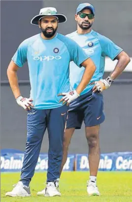  ?? AFP ?? Standin captain Rohit Sharma (left) and Shikhar Dhawan will look to plunder runs at the top when India take on Bangladesh in the Nidahas Trophy final in Colombo on Sunday.