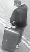  ?? Reuters-Yonhap ?? Salman Abedi is seen with a distinctiv­e suitcase in central Manchester, May 22, the day of the attack, in an image handed out by Greater Manchester Police.