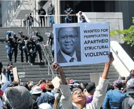  ?? /Esa Alexander ?? Enough: Marikana residents marched to the office of Cape Town’s mayor on Thursday to hand over a memorandum of demands after 11 people were killed in the informal settlement last Friday. A visit by Police Minister Fikile Mbalula has been described as...