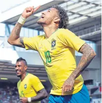  ??  ?? Neymar celebrates after coming off the bench to open the scoring for Brazil against Croatia.