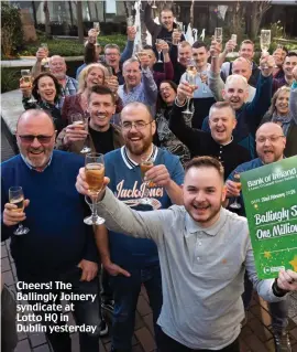  ?? ?? Cheers! The Ballingly Joinery syndicate at Lotto HQ in Dublin yesterday